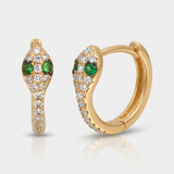 natural diamond snake huggie earrings with green gemstone eyes in 14k gold