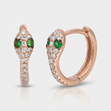 natural diamond snake huggie earrings with green gemstone eyes in 14k gold rose gold