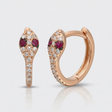 natural diamond snake huggie earrings with ruby eyes in 14k gold rose gold