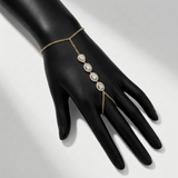 bezel set natural diamond floral station hand chain in 14k gold